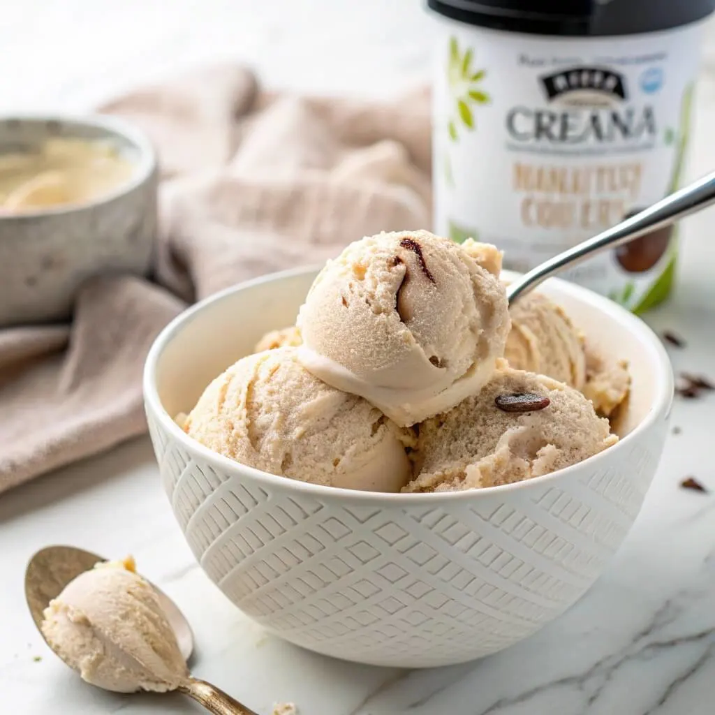 Ninja Creami protein ice cream in a bowl with a spoonful of creamy, high-protein goodness.